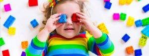 Girl with legos on her eyes in Bee Cave